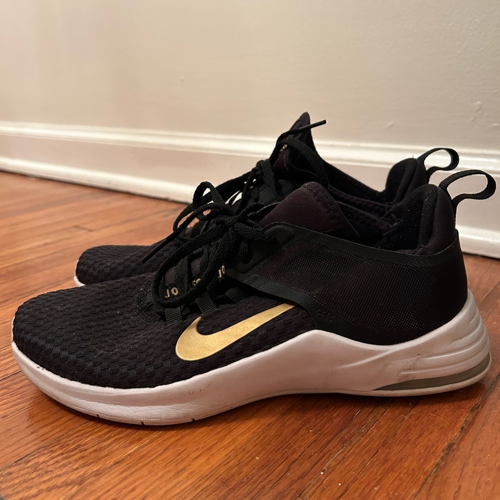 Nike Tennis Shoes. Black gold. Size 8
